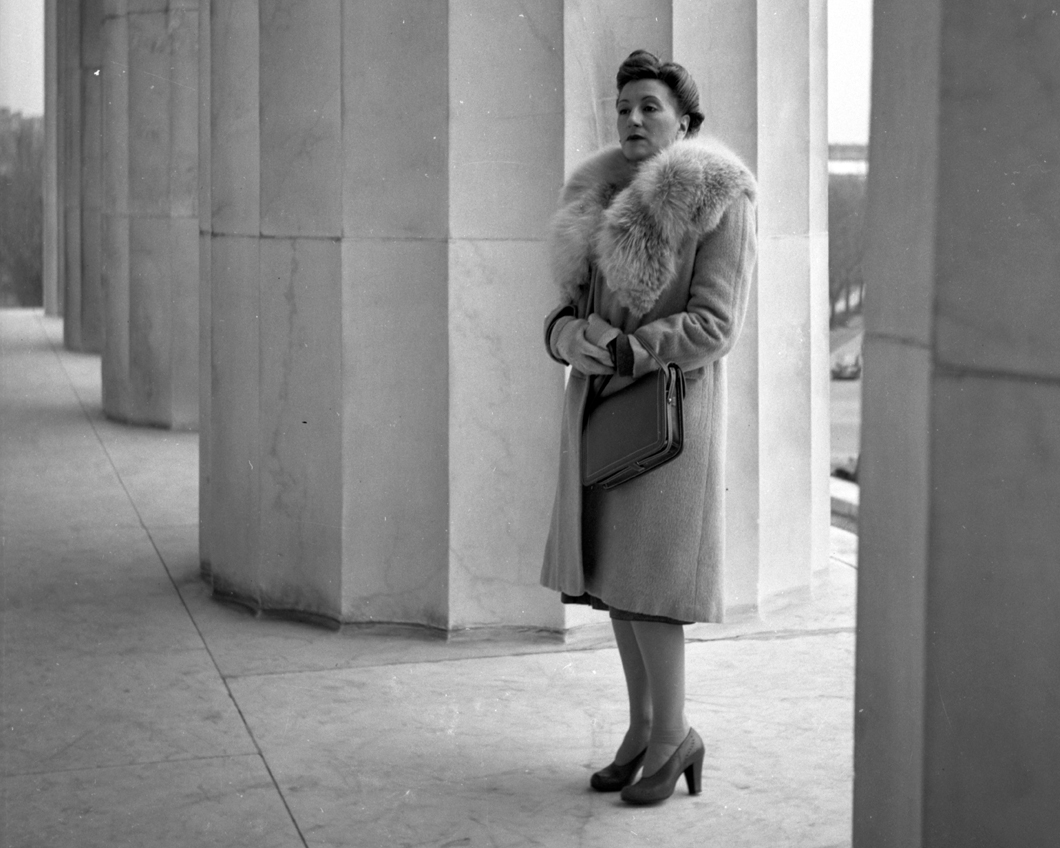 Esperanza with fancy clothes between great stone columns Jan 1948