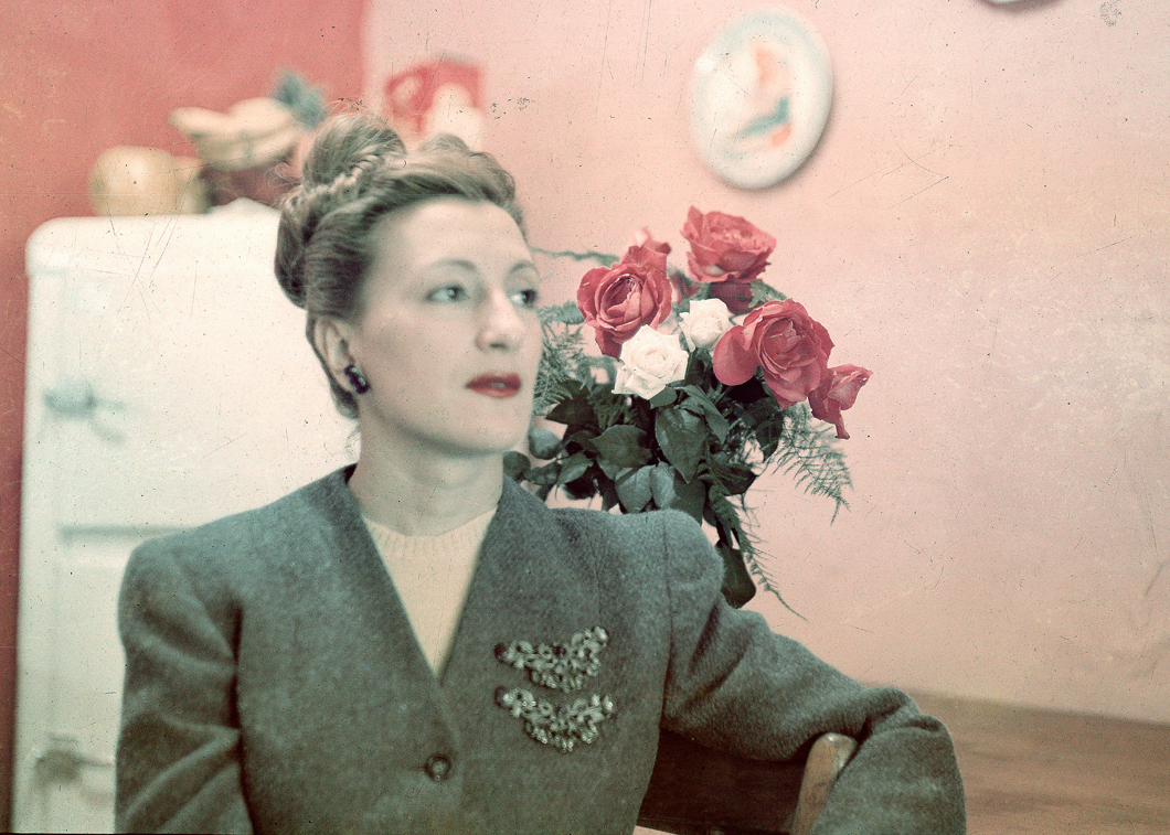 Esperanza Lopez Mateos in apartment with roses on table Jan 1947
