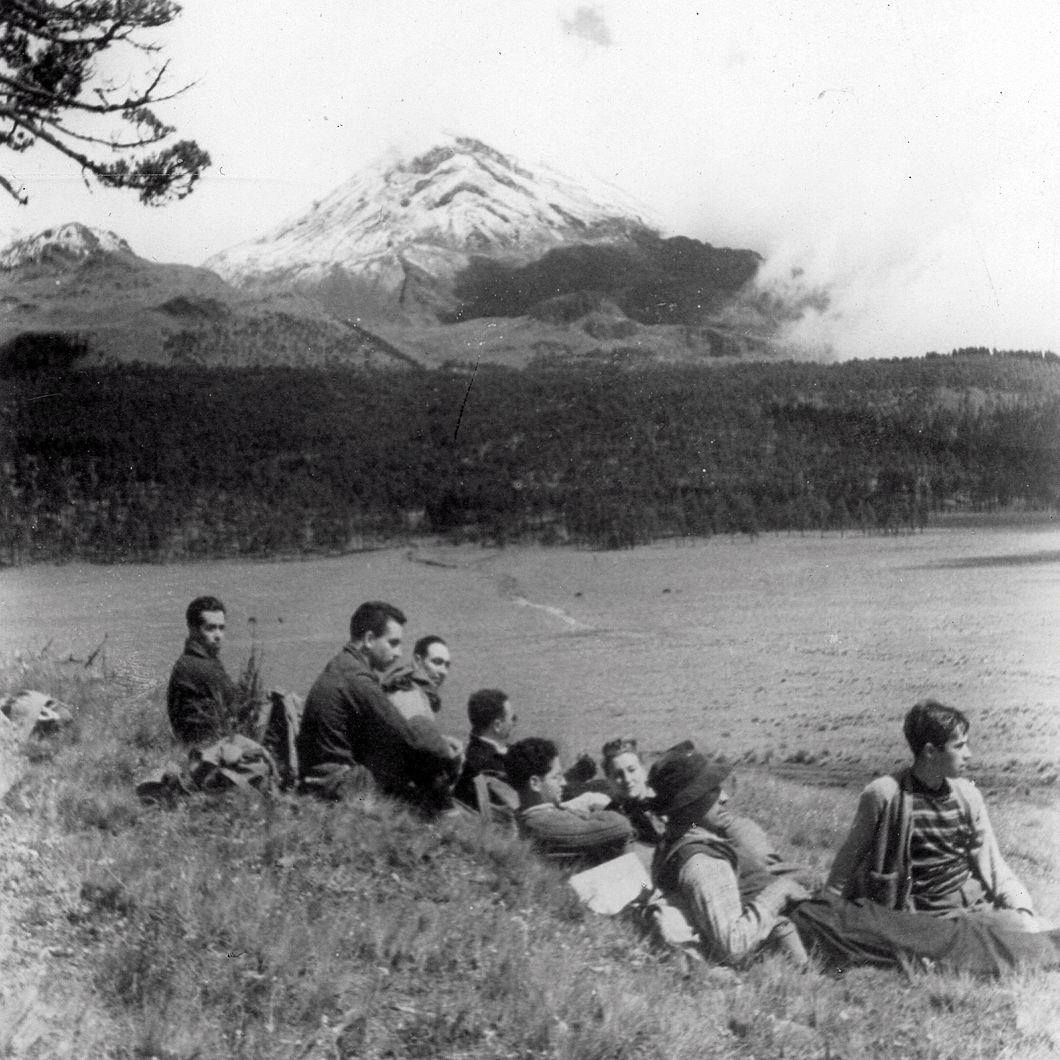 Esperanza with club resting on hillside