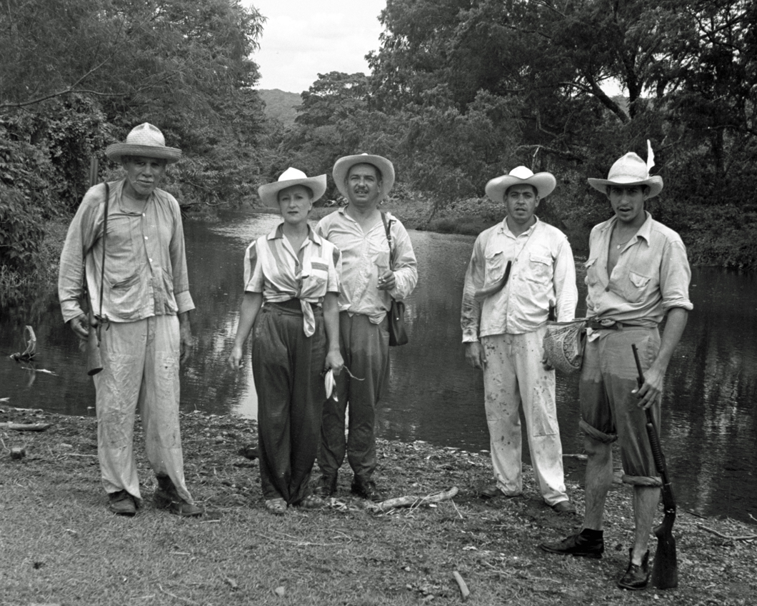 Esperanza with men hunting standing near water