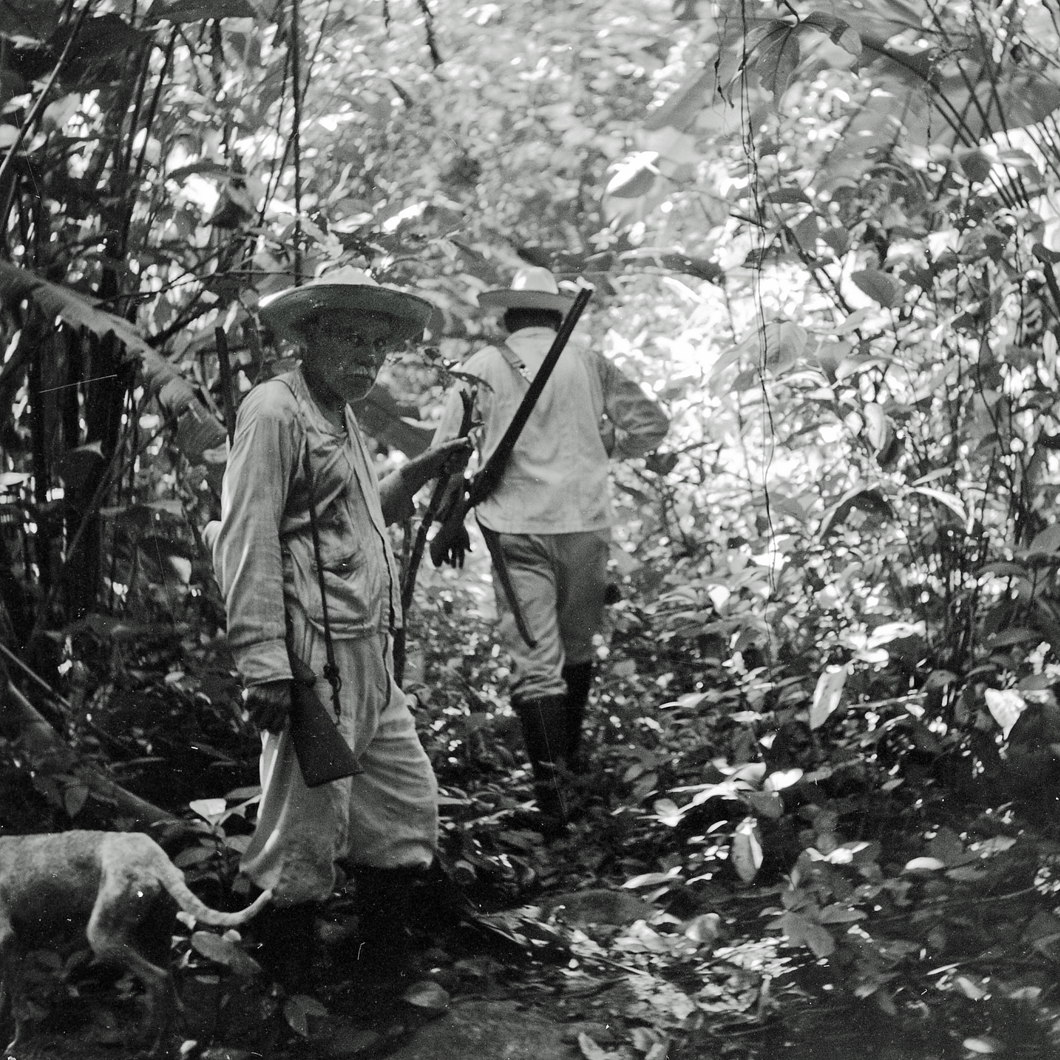 men hunting with dog