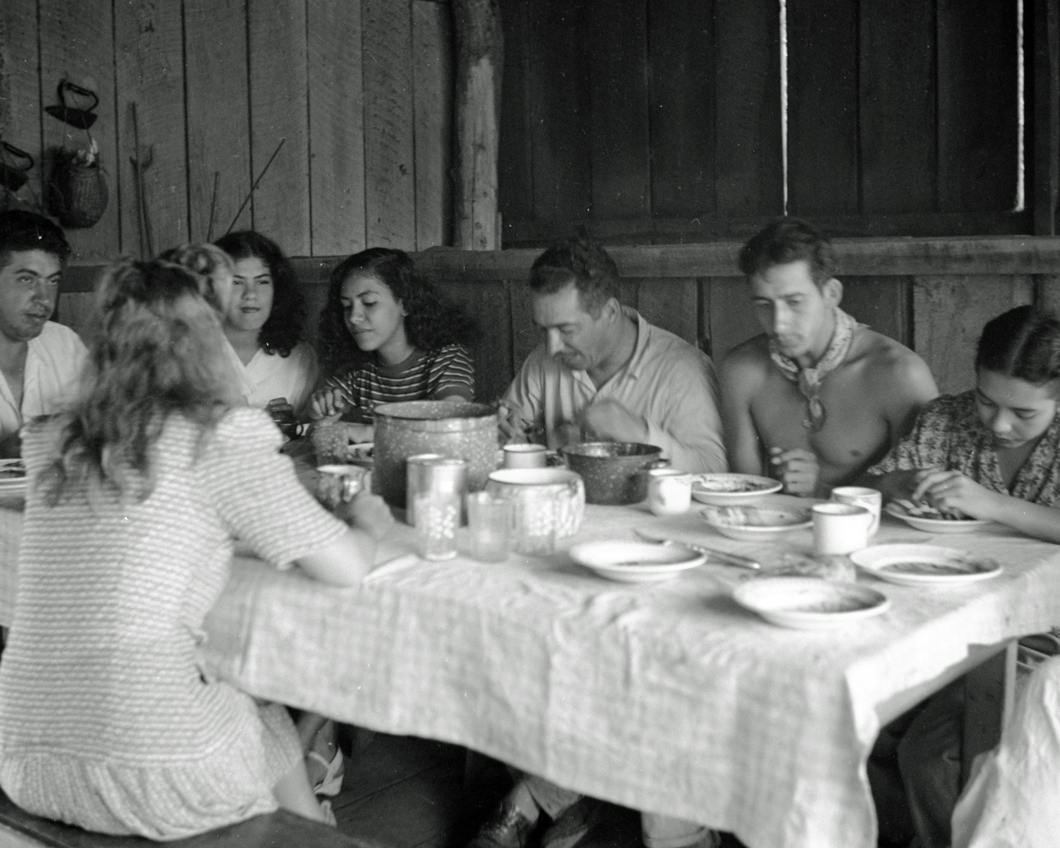 Eating at table inside cabin