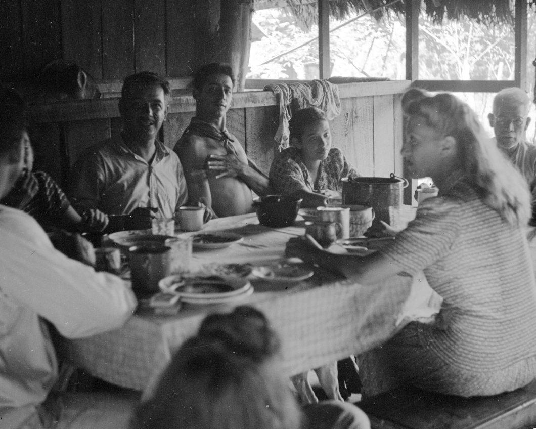 Eating at table inside cabin