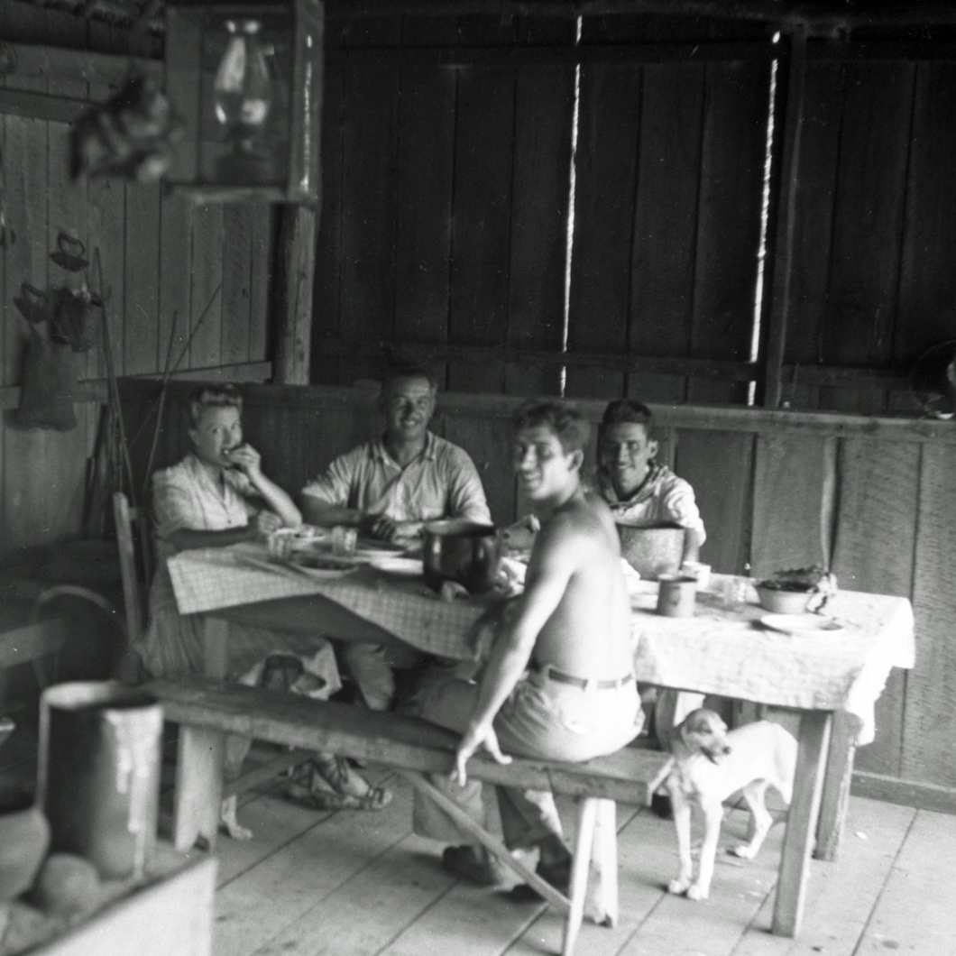 Eating at table inside cabin