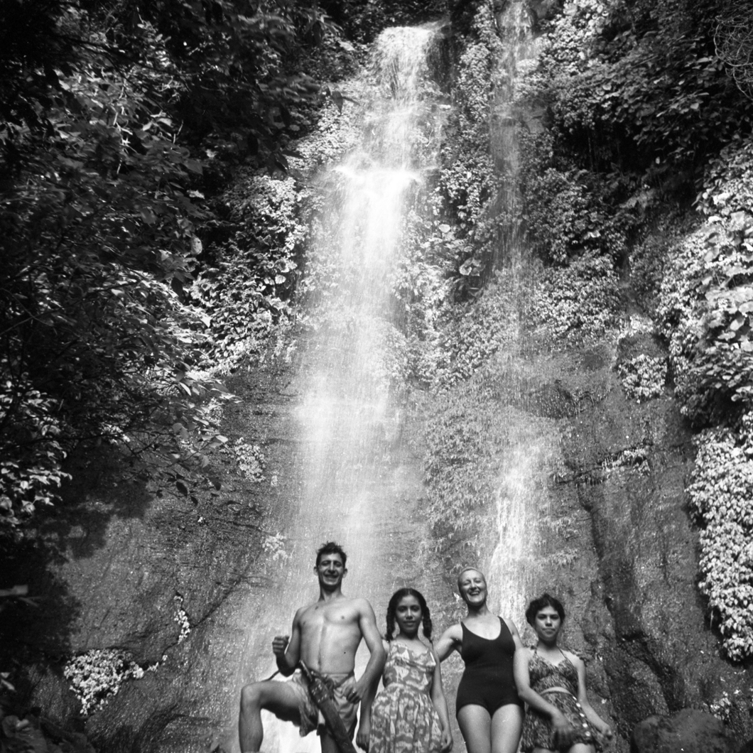 Swimming before a waterfall in the jungle