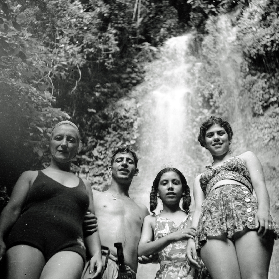 Swimming before a waterfall in the jungle